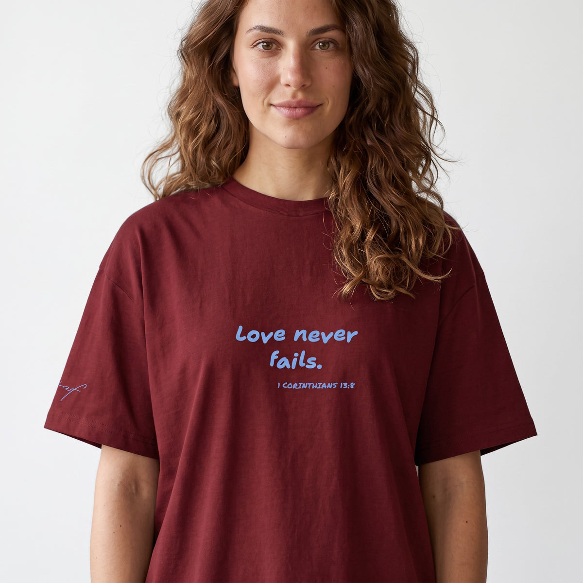 LOVE NEVER FAILS TEE