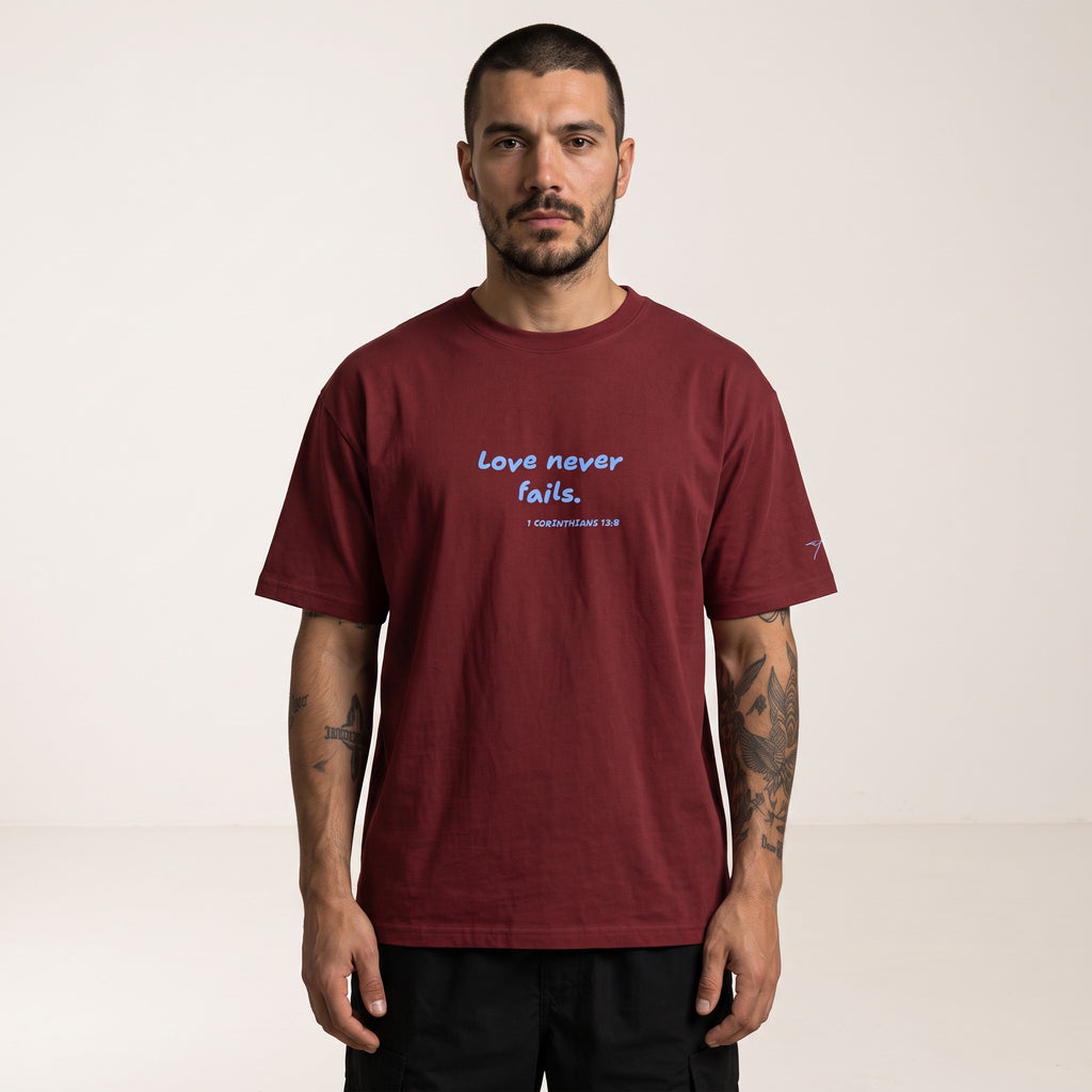 LOVE NEVER FAILS TEE